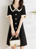 ⁦فستان نسائي أسود متباين الألوان⁩ - الصورة ⁦2⁩